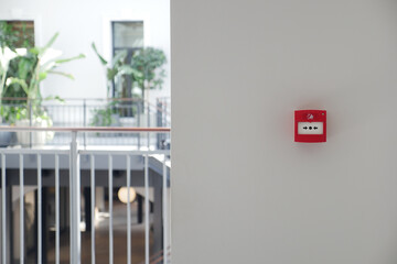 Red fire alarm button on wall ,