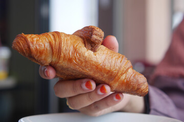 top view of hand pick fresh baked croissant 