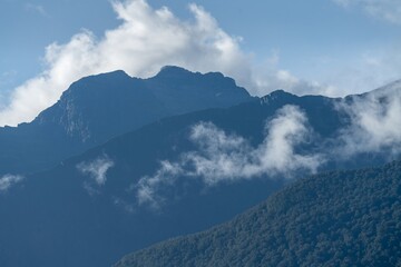 Clouds on the mountains in the Southern Alps. Haast, West Coast, New Zealand.