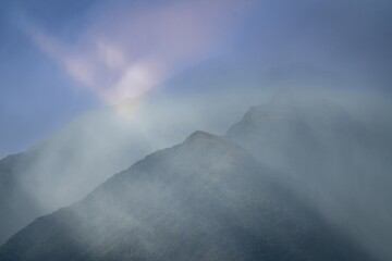 Brooding storms clouds over the Southern Alp mountain range. Haast, West Coast, New Zealand.