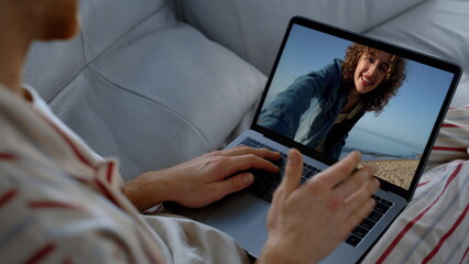 Guy making web call at home closeup. Happy travel girl talking boyfriend online