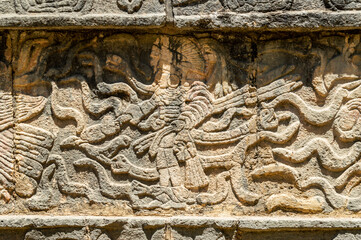mayan hieroglyphs on wall in mayan city of chichen itza, yucatan, mexico