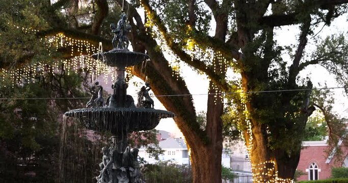Water cascades down a historic fountain in downtown Natchez, Mississippi, USA.