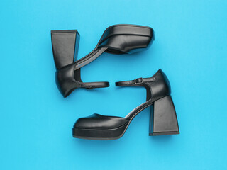 Black Chunky Platform Heels on Vibrant Blue Background - Fashion Trendy Footwear