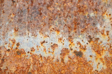 Corroded metal background. Rusted grey painted metal wall. Rusty metal background with streaks of rust. Rust stains.