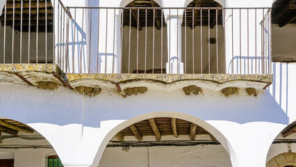 Swallow's nests under the arcades of a whitewashed building