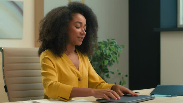 African American business woman female businesswoman workaholic manager executive finish accomplish project end working day close laptop tired overworked happy girl lean on chair relaxing at office