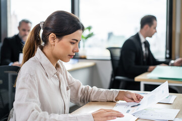 Asian beautiful businesswoman using laptop computer working in office.