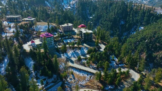 Orbit drone footage of the hotel on top of the mountain in Malam Jabba Sawat in northern Pakistan 