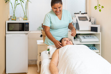 Masseur attending a client in a wellness spa