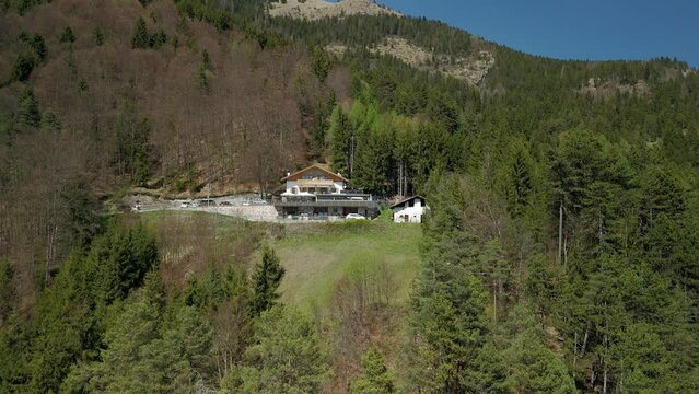 Restaurant near Nardis Waterfall, Trentino, Italian Alps, Italy. Aerial drone ascending