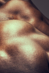 Skin, back and muscles with texture closeup in studio for power, strong and fitness body of workout...