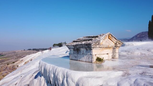 Breathtaking Landscape: Pamukkale, Turkey (T&uuml;rkiye) Natural hot springs minerals forming travertine limestone mineral deposit formations. Ancient tomb grave. Peaceful calming video. Hierapolis. 4K UHD
