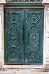 Metal door of house with ornates in jewish gheto in Venice