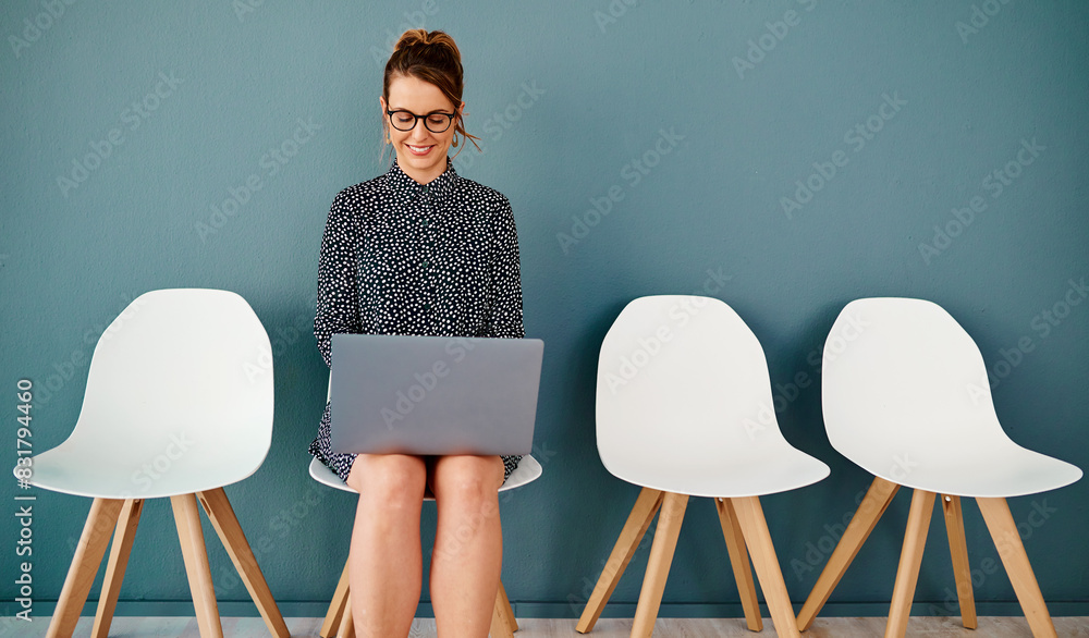 Poster Smile, laptop and woman in waiting room for interview, job application or recruitment on chair. Hiring, typing and female person with technology in office for opportunity, onboarding or employment