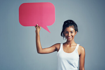 Speech bubble, girl and portrait in studio for social media, comment and opinion on grey...