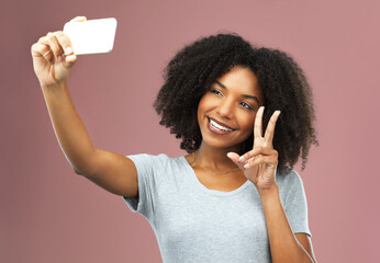 Peace sign, selfie and female influencer in studio for social media, photography and status update...