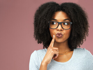 Black woman, studio and glasses with hand for thinking, idea or goal for future wellness. Female...