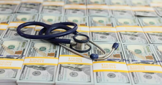 Earning money for people health and stethoscope with bundles of money