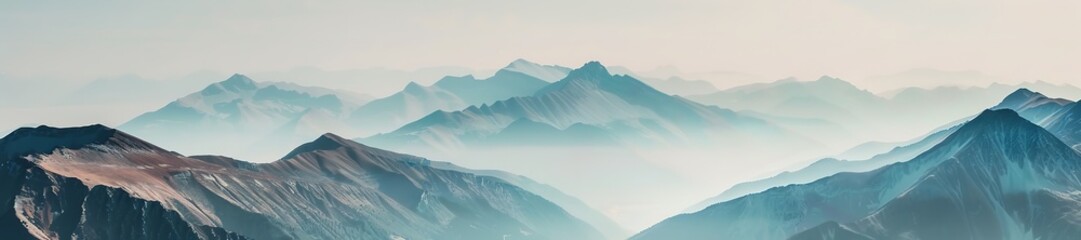 Misty mountains with layered peaks in tranquil hues.