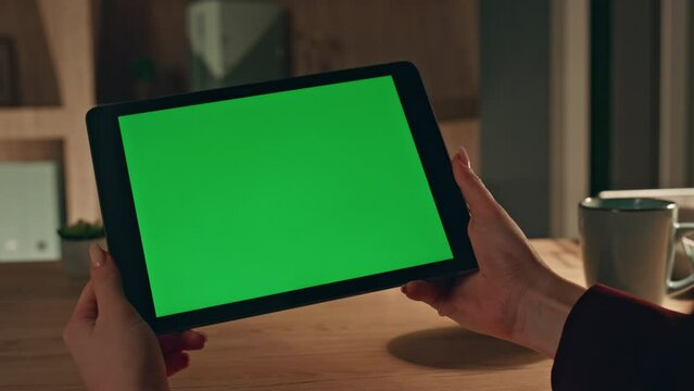 Student looking course mockup tablet in horizontal position at home close up. 