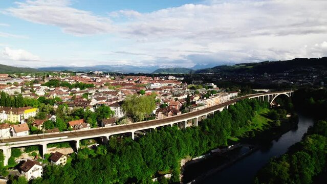 Bern, Switzerland skyline with Alps in distance, 4K aerial view