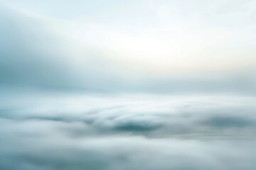 Ethereal view of soft, cloudy sky at sunrise, creating a dreamy and tranquil atmosphere with light pastel colors and serene calmness.