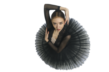 portrait of a young ballerina in a black tutu dancing with her hands moving top view, immersion in dance, isolated on transparent background, png