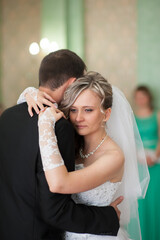 Naklejka premium This day is first of many wonderful days spent together. I'm so happy I met you. Photo shows happy young couple standing together on their wedding day. Vertical image.