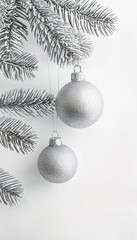 Silver Christmas balls on a Christmas tree in the snow on a white background 