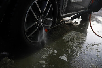 Self-service express car wash. Outdoor high pressure washing for cars.