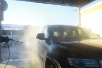 Obraz premium Self-service express car wash. Outdoor high pressure washing for cars.