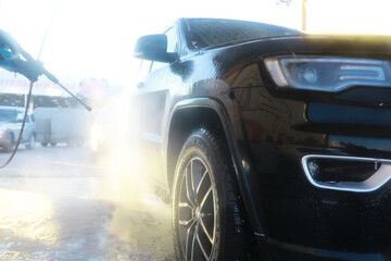 Self-service express car wash. Outdoor high pressure washing for cars.
