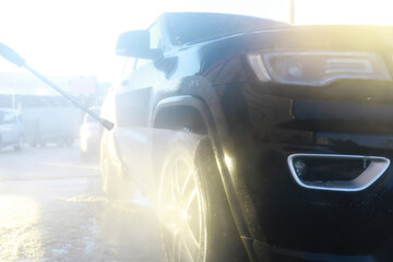 Self-service express car wash. Outdoor high pressure washing for cars.