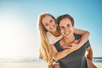 Portrait, piggy back and beach with couple, smile and sunshine with happiness, honeymoon and...