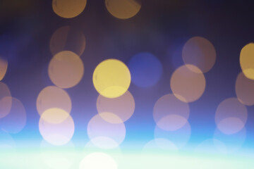 Abstract bokeh background. Golden bokeh circles on dark blue background. Layer overlay.