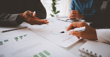 Asian Business Advisory Meeting to analyze and discuss the financial report situation in the meeting room investment consultant financial advisor online marketing accounting concepts.
