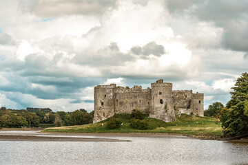 Carew Castle in Wales exterior view over the nearby river is an historic point of interest for tourists to visit