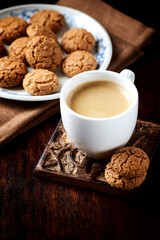 Cup of coffee on wooden background. Close up.