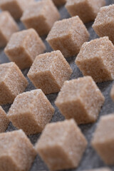 Straight rows of cane sugar cubes. Effect of dynamics.