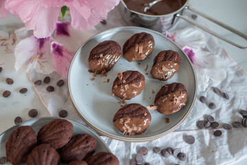 Homemade Chocolate Madeleines on dark table