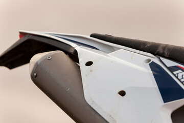 detailled close up of the exhaust and rear of a motorcycle dirt bike