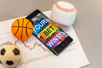 Football Business Concept. Ball and smartphone with bet application. Soccer gambling money concept