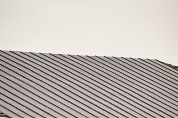 new roof of a building against a background of gray sky