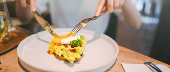 Guacamole avocado healthy food and asian woman background at indoor restaurant on day