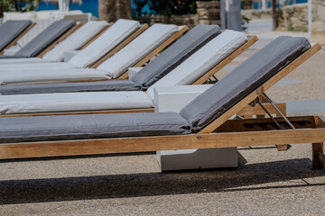 Closeup view of various sun beds and at a beach bar in Ios Greece