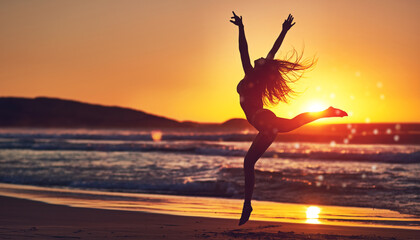 Woman, sunset and jumping silhouette on seashore, contemporary dancing and energy in nature with dancer. Wellness, freedom and movement on summer vacation, beach and water with stretched body