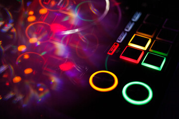 Fototapeta premium Defocused entertainment concert lighting on stage, blurred disco party and Concert Live , music mixer DJ controller in booth at nightclub , dance music djs for the rest of your life