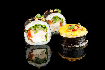 Sushi Hot Roll, Sushi menu. Japanese food.Set with fried and baked rolls, sushi on a black board on a light table.