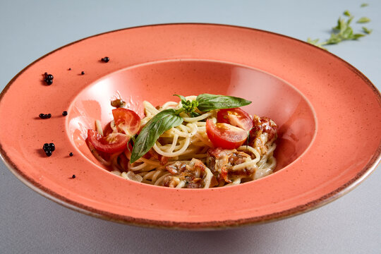 Delightful Carbonara pasta served in a terracotta dish, top view perfect for Italian cuisine recipes and food bloggers